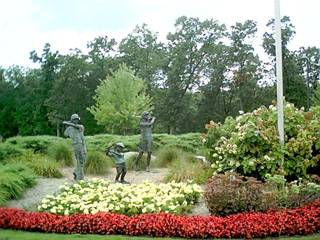 Statues of Children Golfing near the entrance 